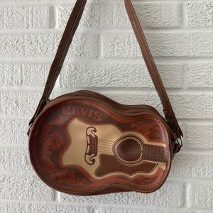 Collectors Paul Frank Elvis guitar crossbody bag.